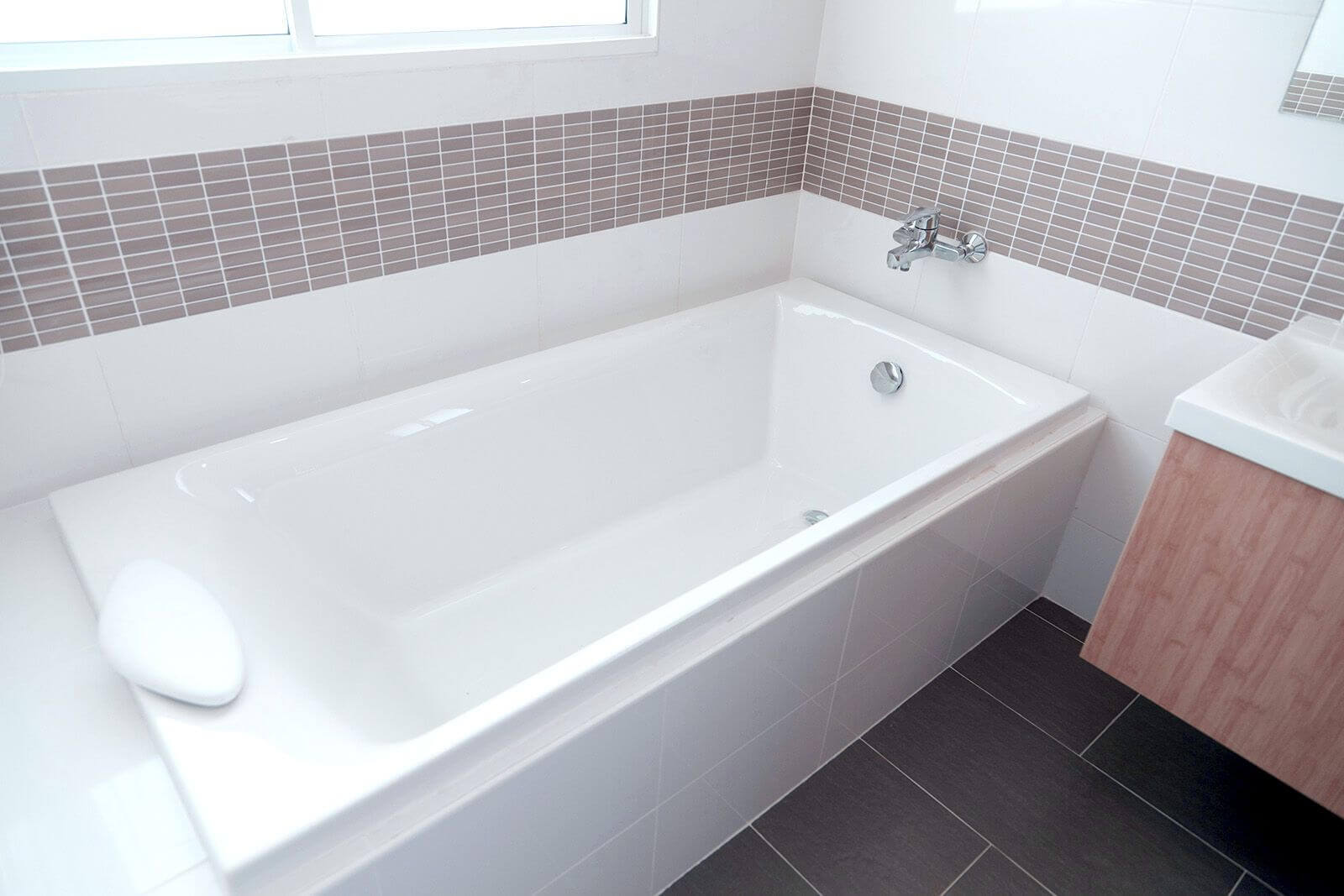 Clean bathtub with surrounding tile