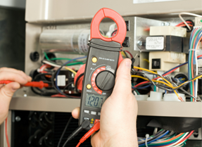 A technician repairing an HVAC system